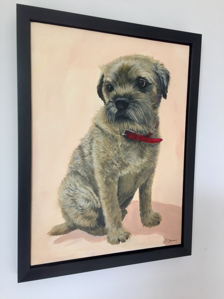 Framed painting of a border terrier