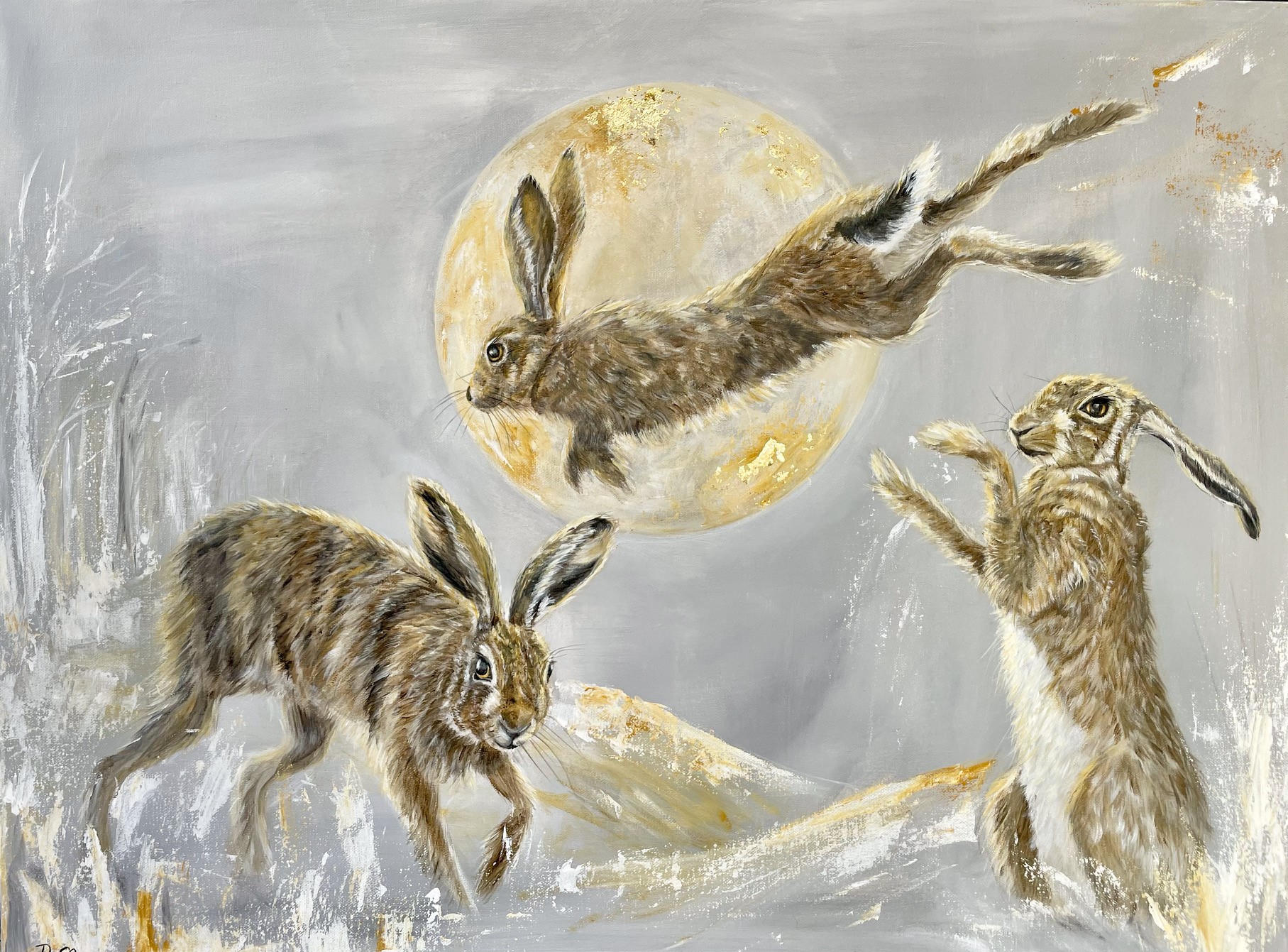 Painting of three hares playing in the snow and jumping over the moon, by Debbie Storey