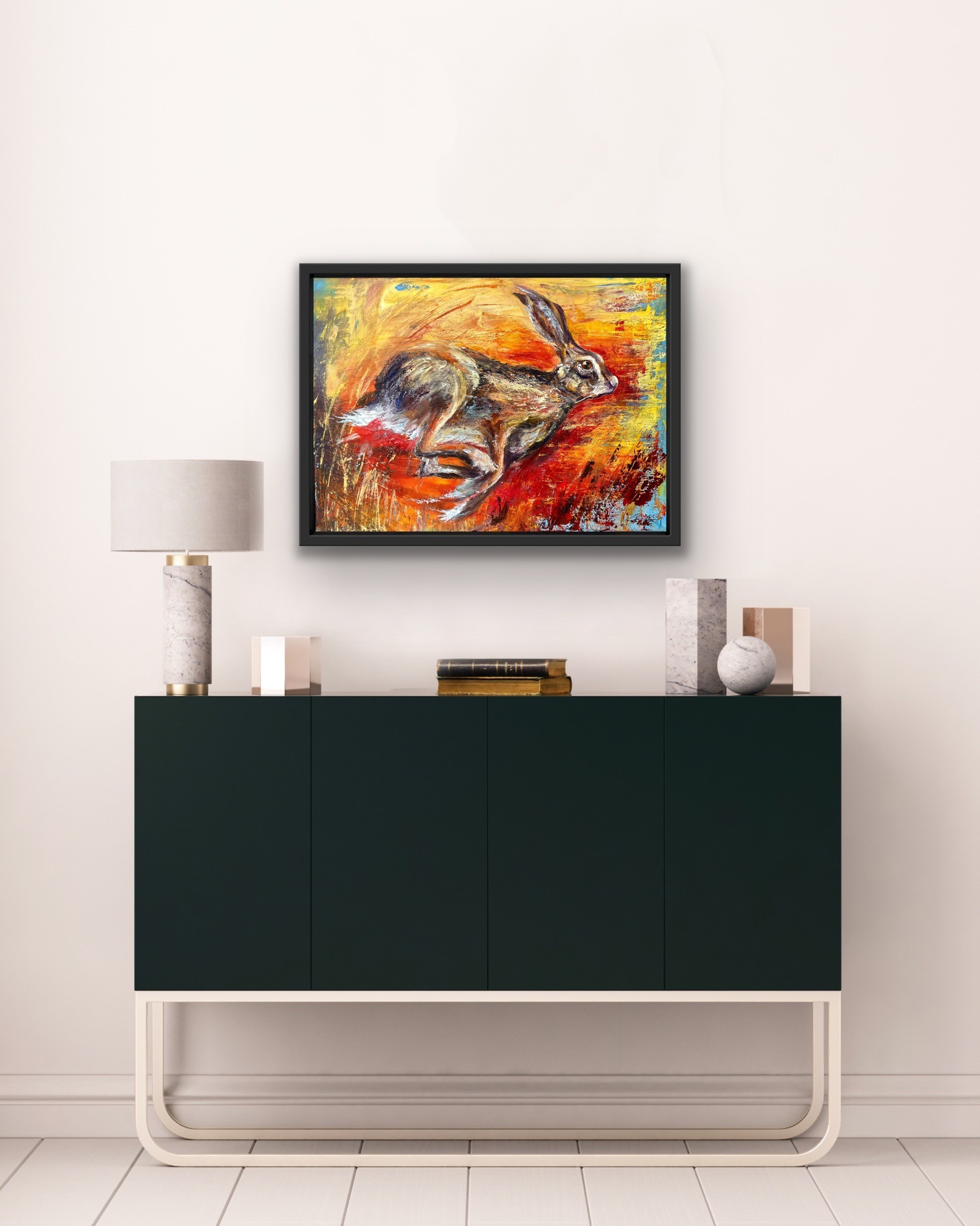 Painting of a hare running in a black frame, by Debbie Storey