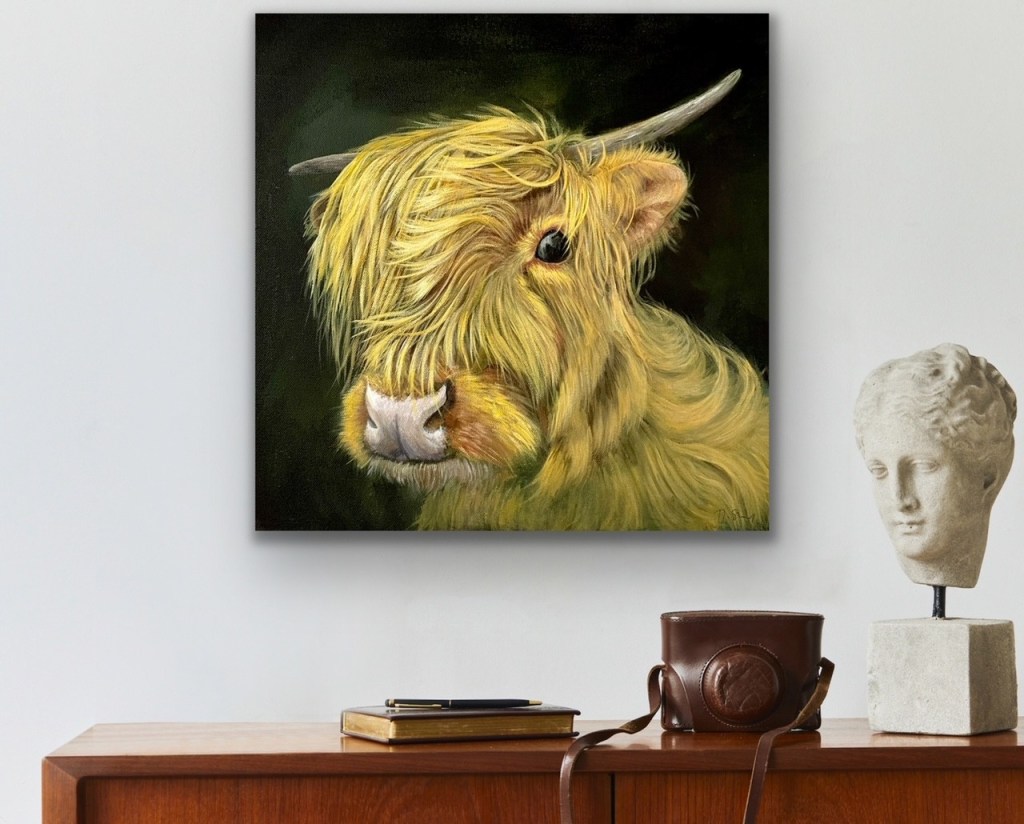 Acrylic painting of a highland cow on a black background hanging on a wall